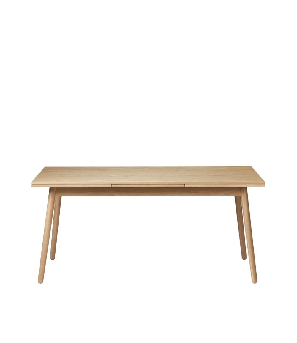 FDB Møbler Dining table With Dutch extract in solid oak, designed by Poul M. Volther