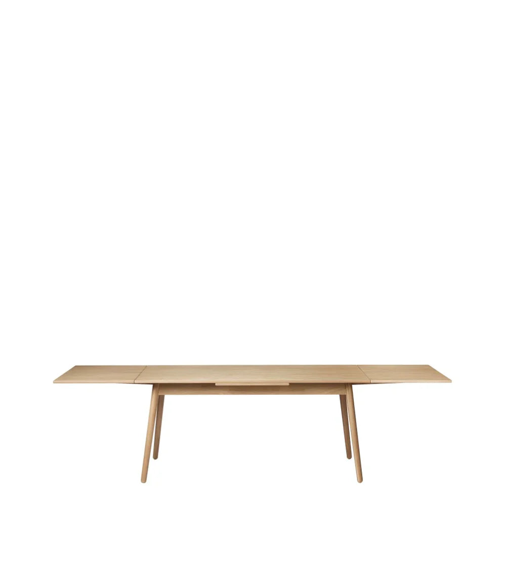 FDB Møbler Dining table With Dutch extract in solid oak, designed by Poul M. Volther