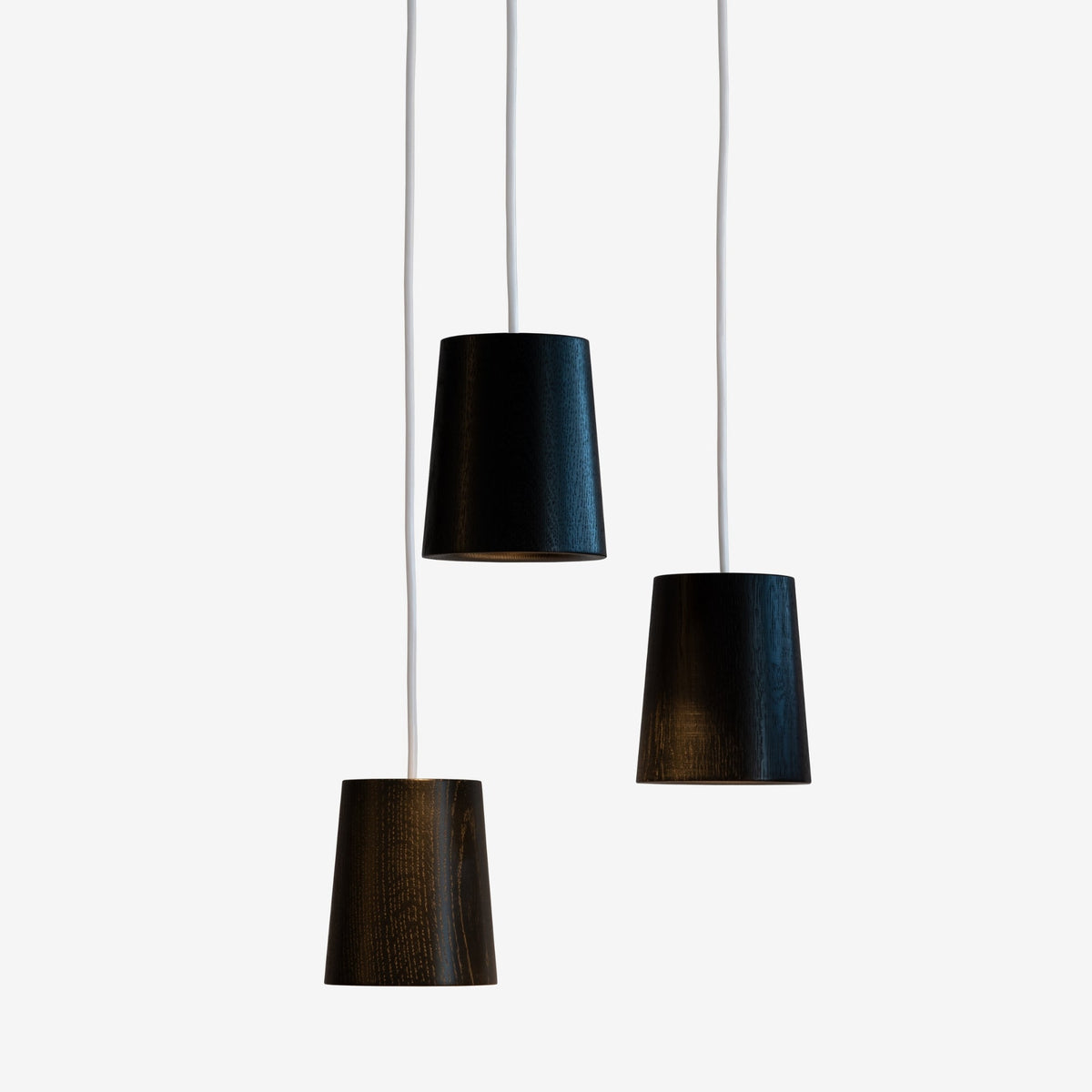 Case Solid Three Pendant Cluster in Black Stained Oak, staggered cones, black stained solid oak