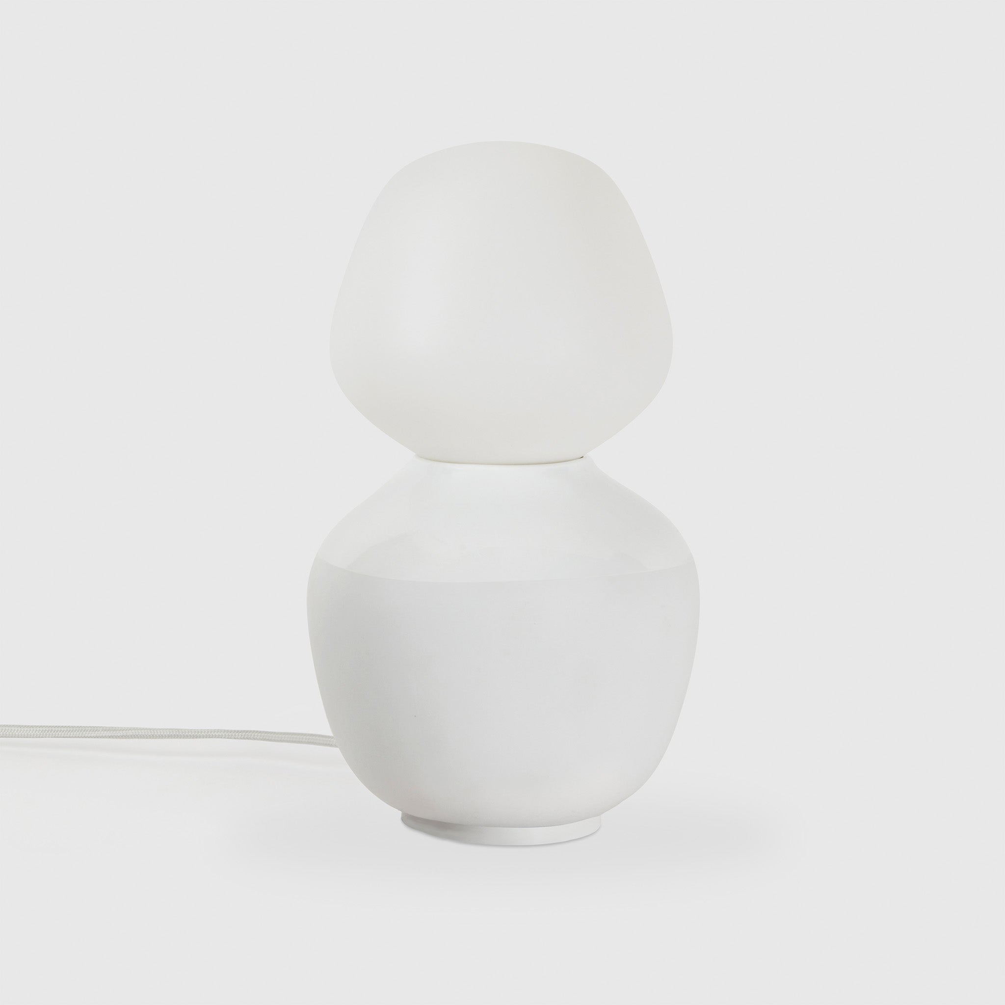 Tala Reflection Enno Table Lamp, off, on grey background