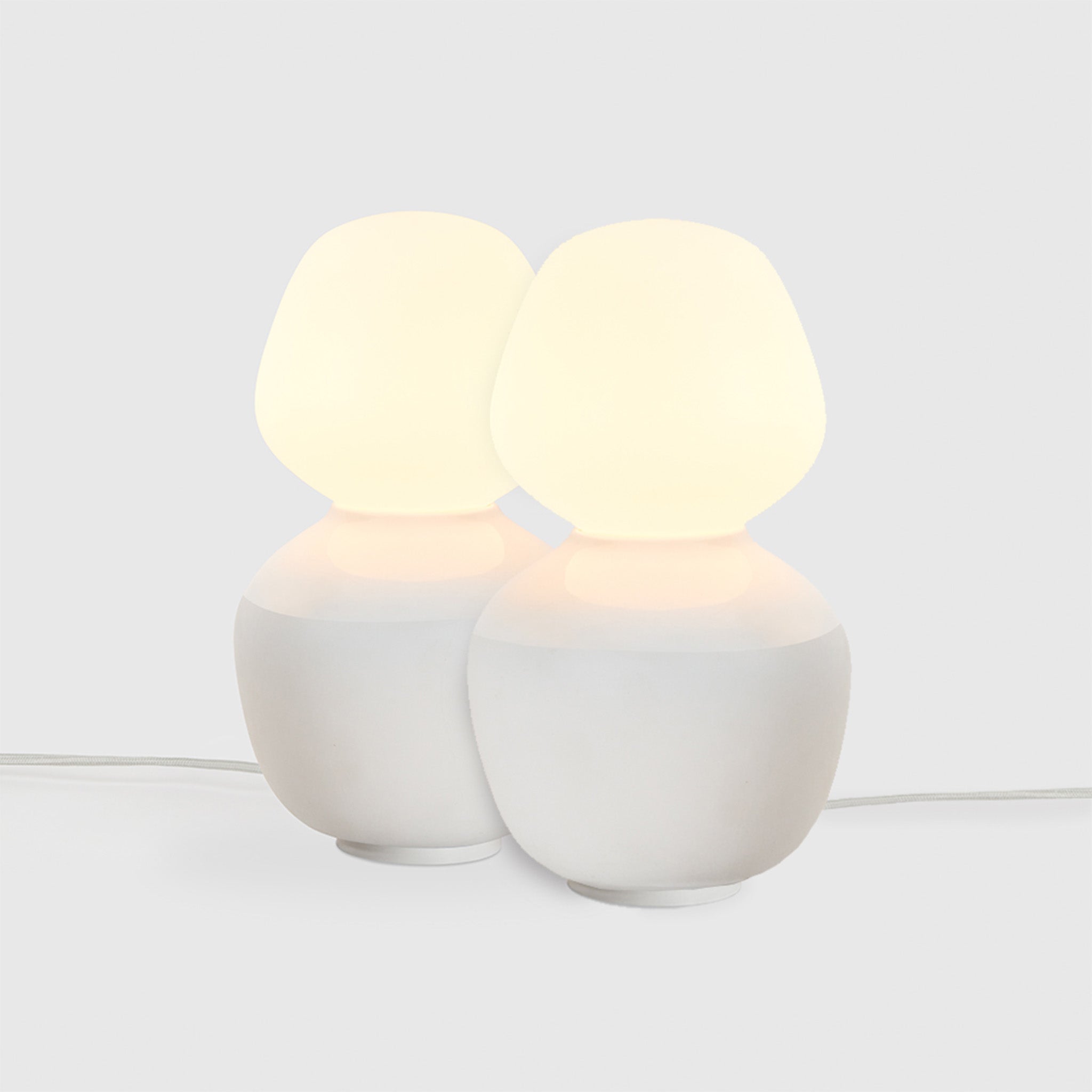Tala Reflection Enno Table Lamps, Set of 2, lit, on grey background