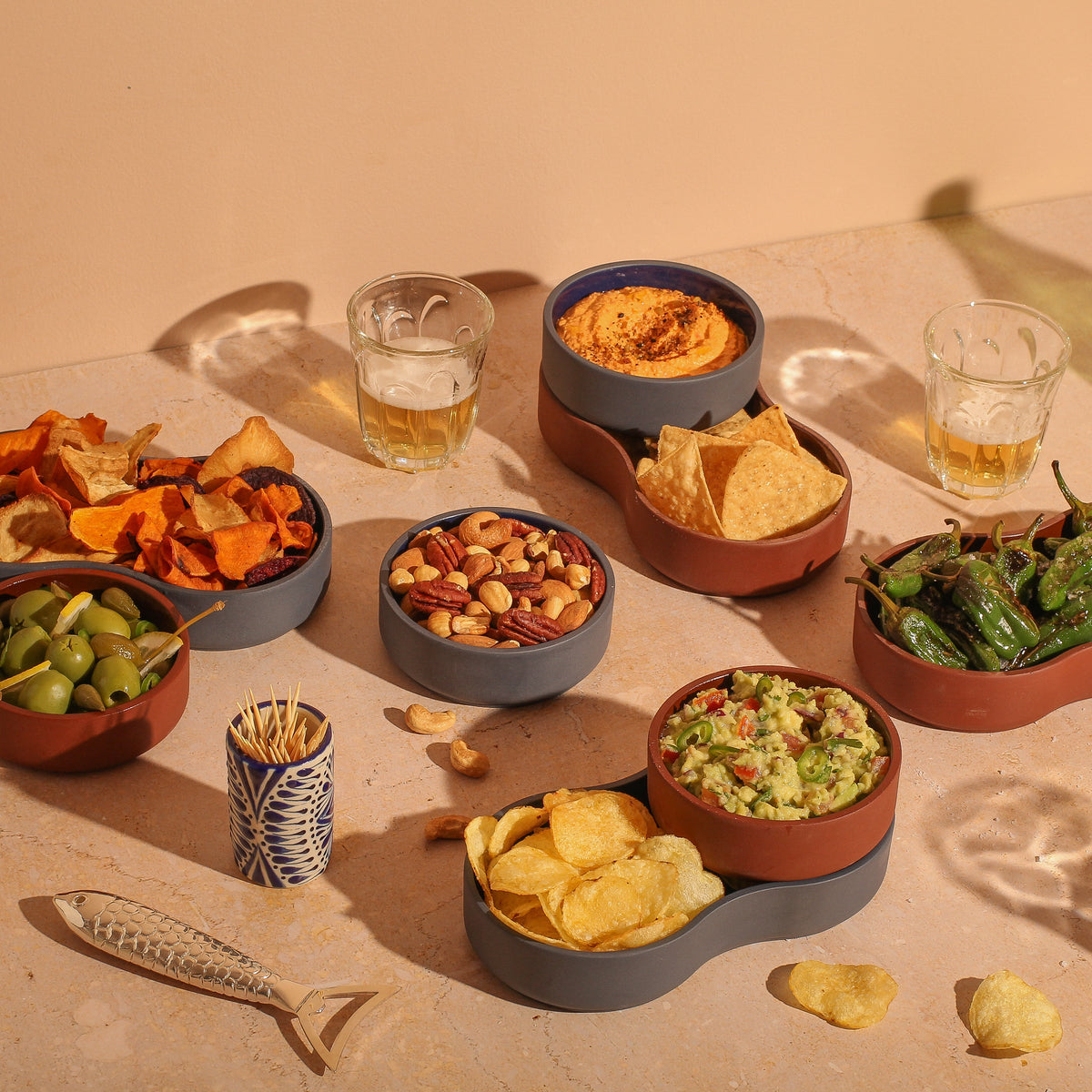 Case Dip Bowl in Blue and Brown, styled on a kitchen counter with snacks, solid-colored porcelain