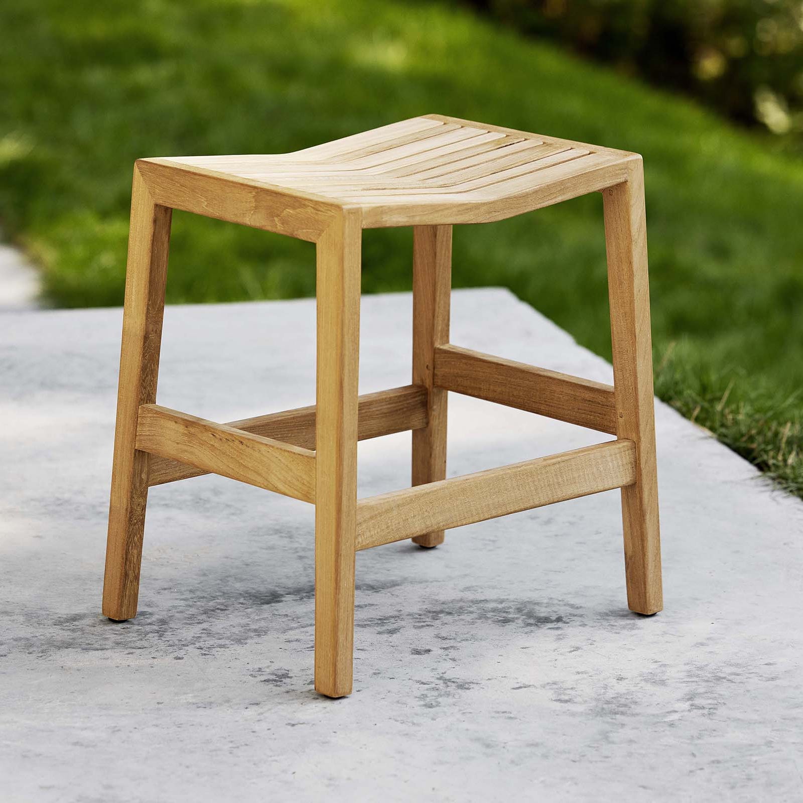 Flip wooden stool by Cane-line, eco friendly outdoor furniture accessory from Comosum