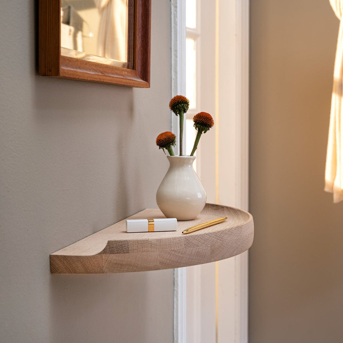Aakjaer Arcus Console Shelf in white oiled oak used as a hallway console below a mirror