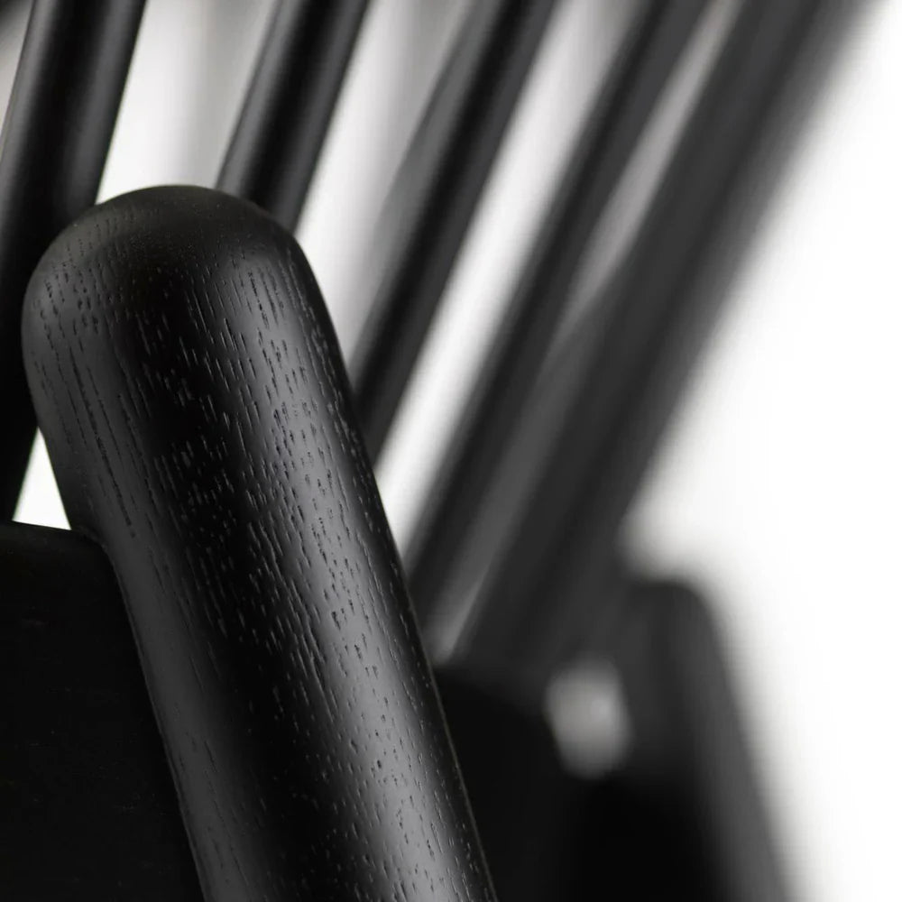 FDB Møbler Jørna Chair in jet black (green), designed by Poul M. Volther