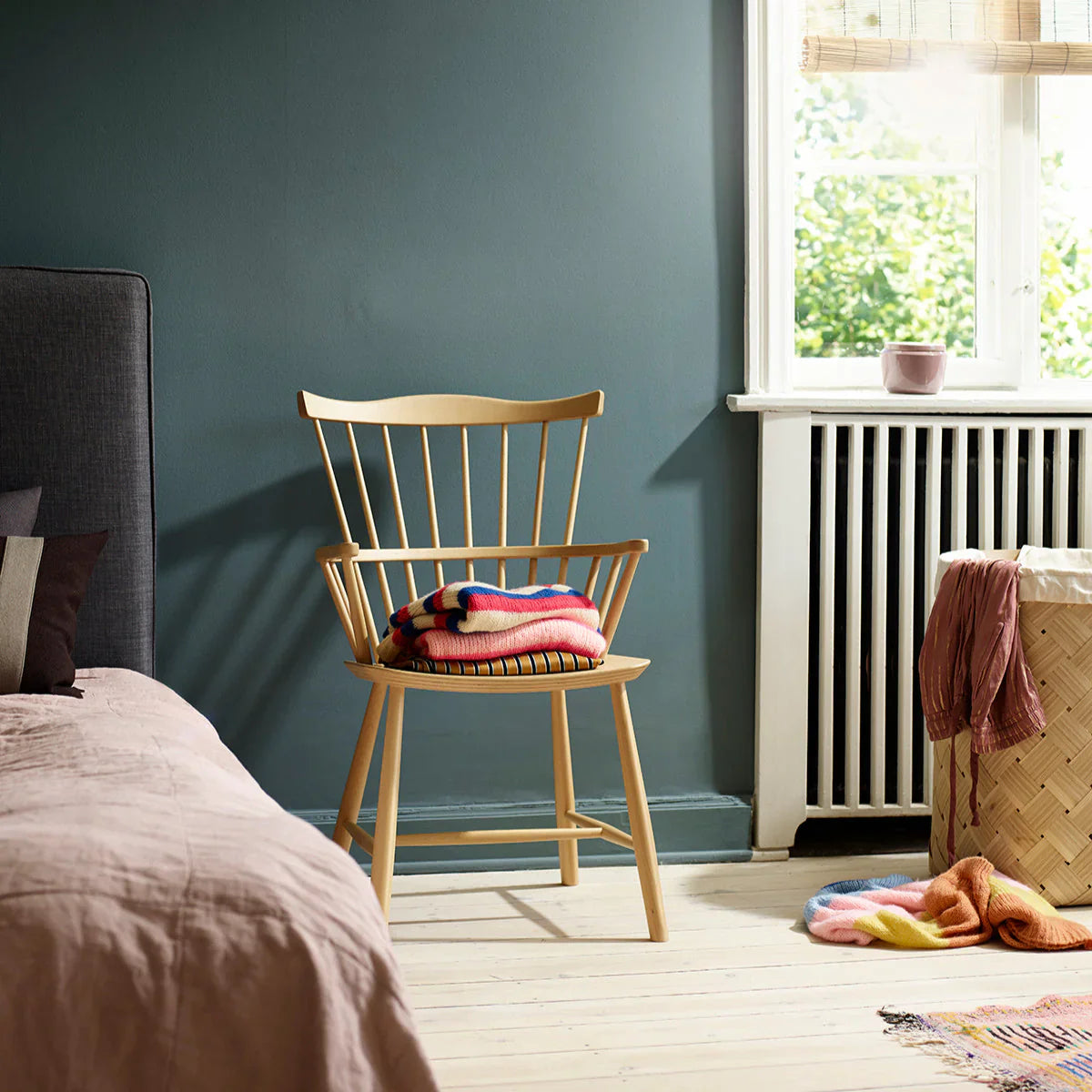 FDB Møbler Chair in natural solid beech styled in an interior setting