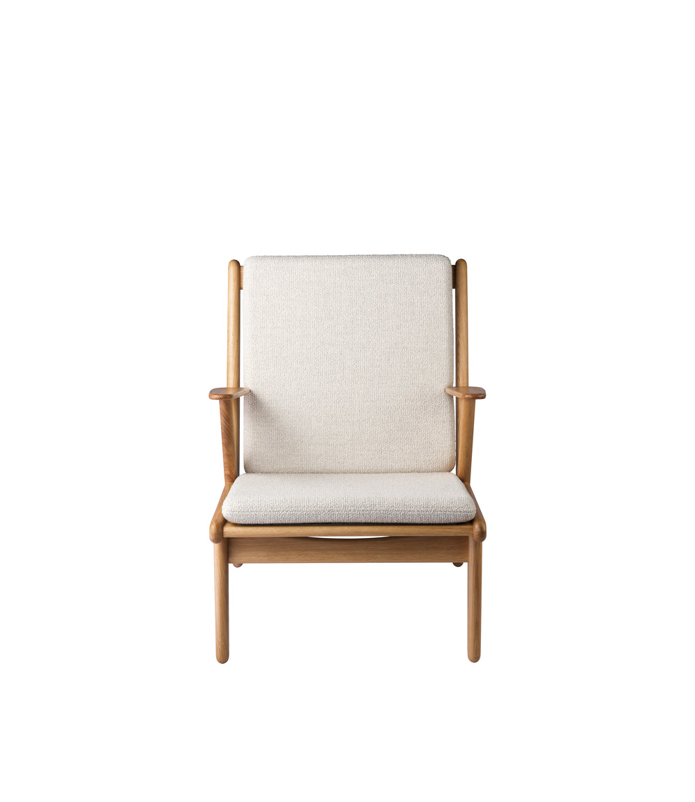 FDB Møbler Armchair in solid oak (beige), designed by Poul M. Volther