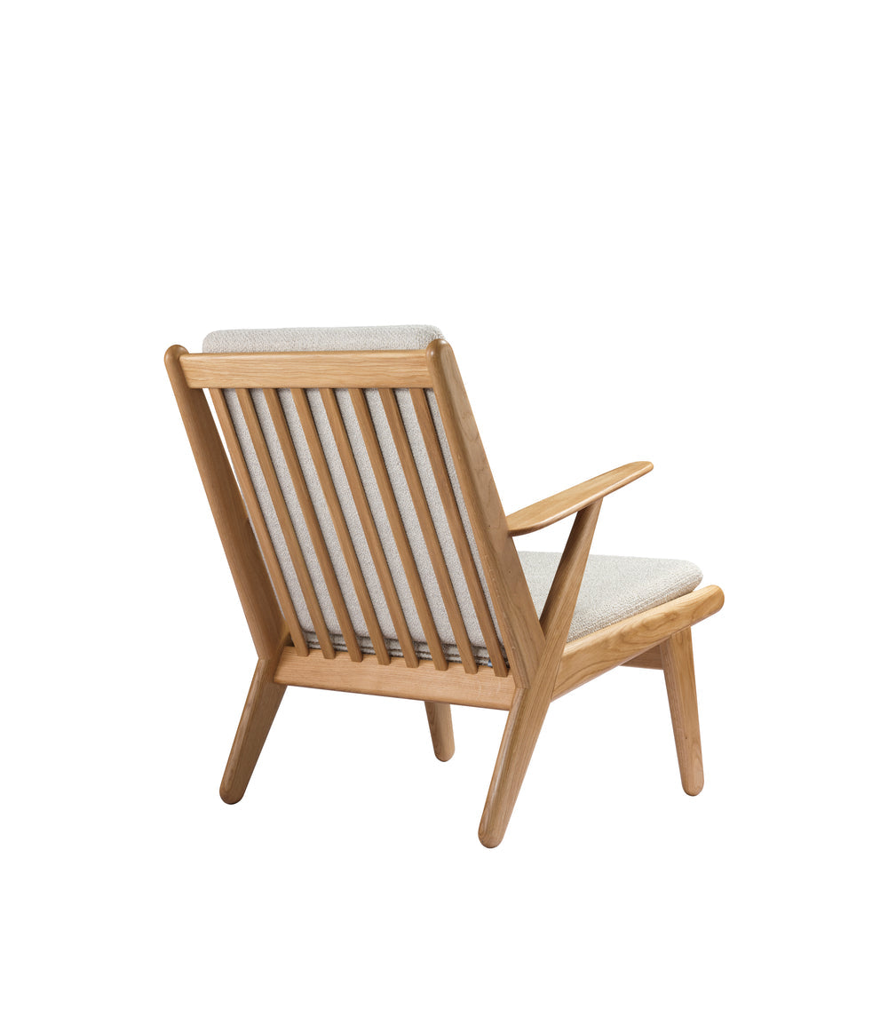 FDB Møbler Armchair in solid oak (beige), designed by Poul M. Volther
