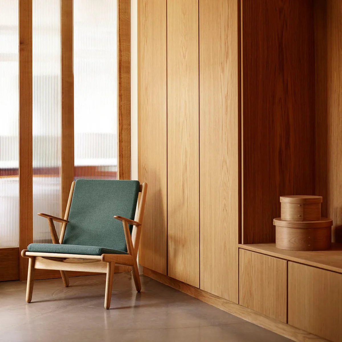 FDB Møbler Armchair in solid oak (green), designed by Poul M. Volther
