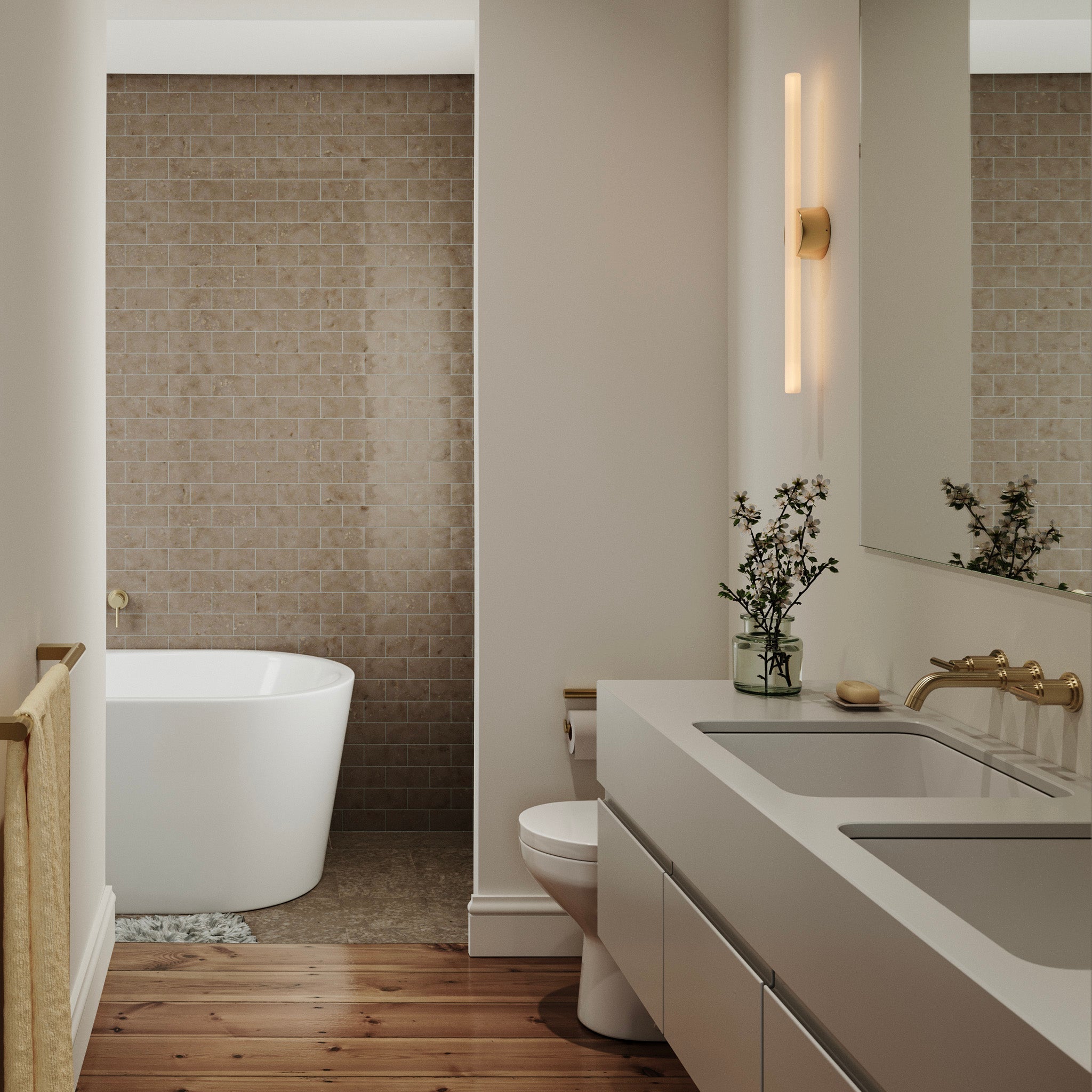 Kilter 1.0 Wall Light in Solid Brass, three-quarter angle, bathroom lifestyle