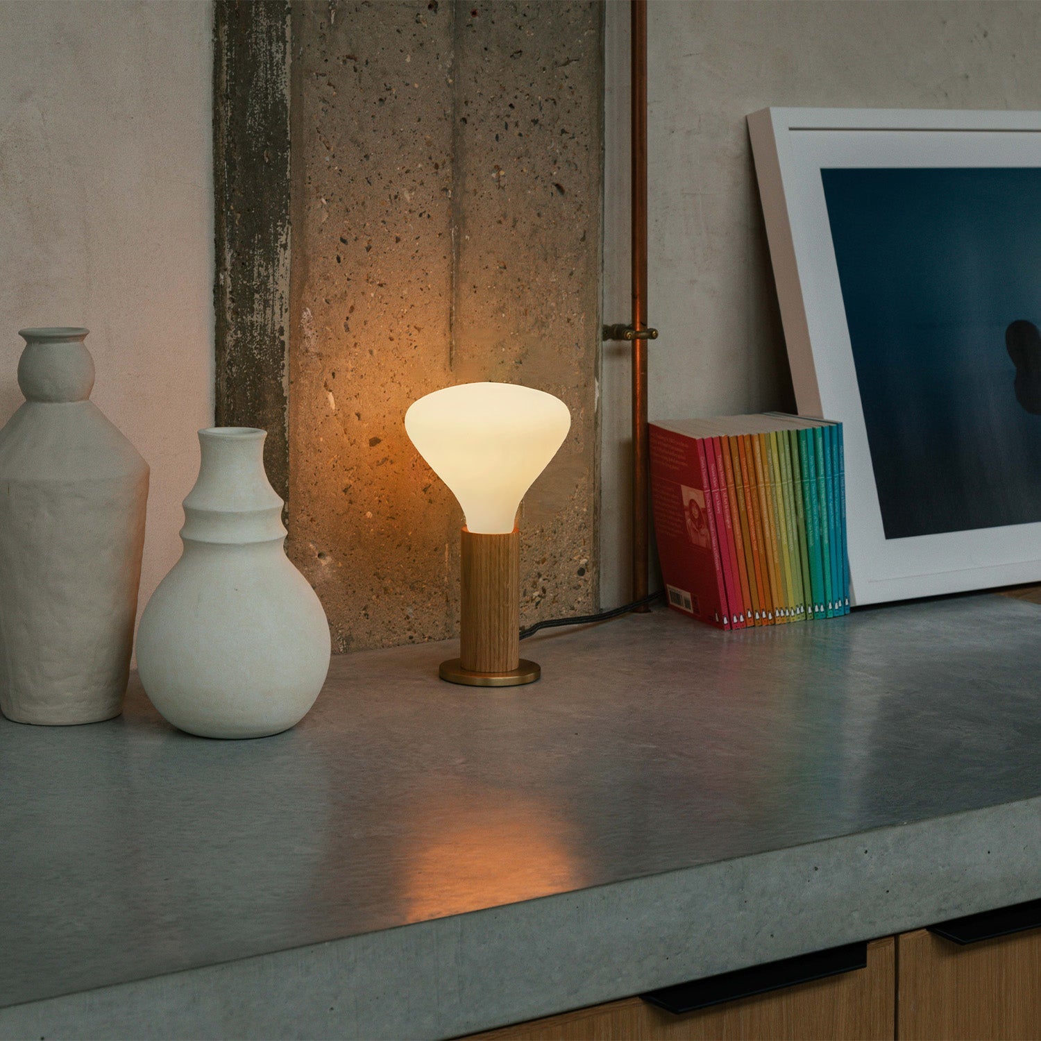 Knuckle Table Lamp in Oak with Noma bulb, lifestyle setting