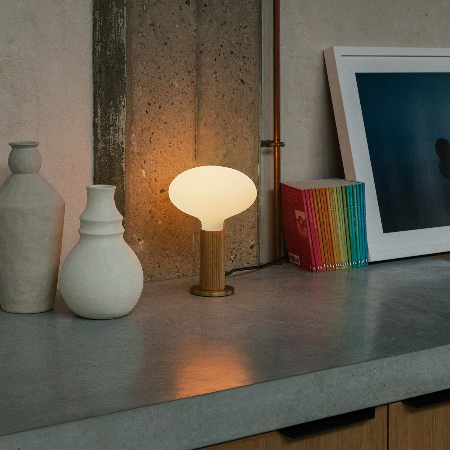 Knuckle Table Lamp in Oak with Oval bulb, lifestyle setting