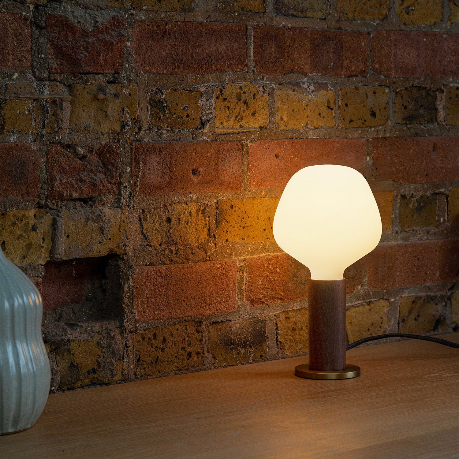 Knuckle Table Lamp in Walnut with Enno bulb, lifestyle setting