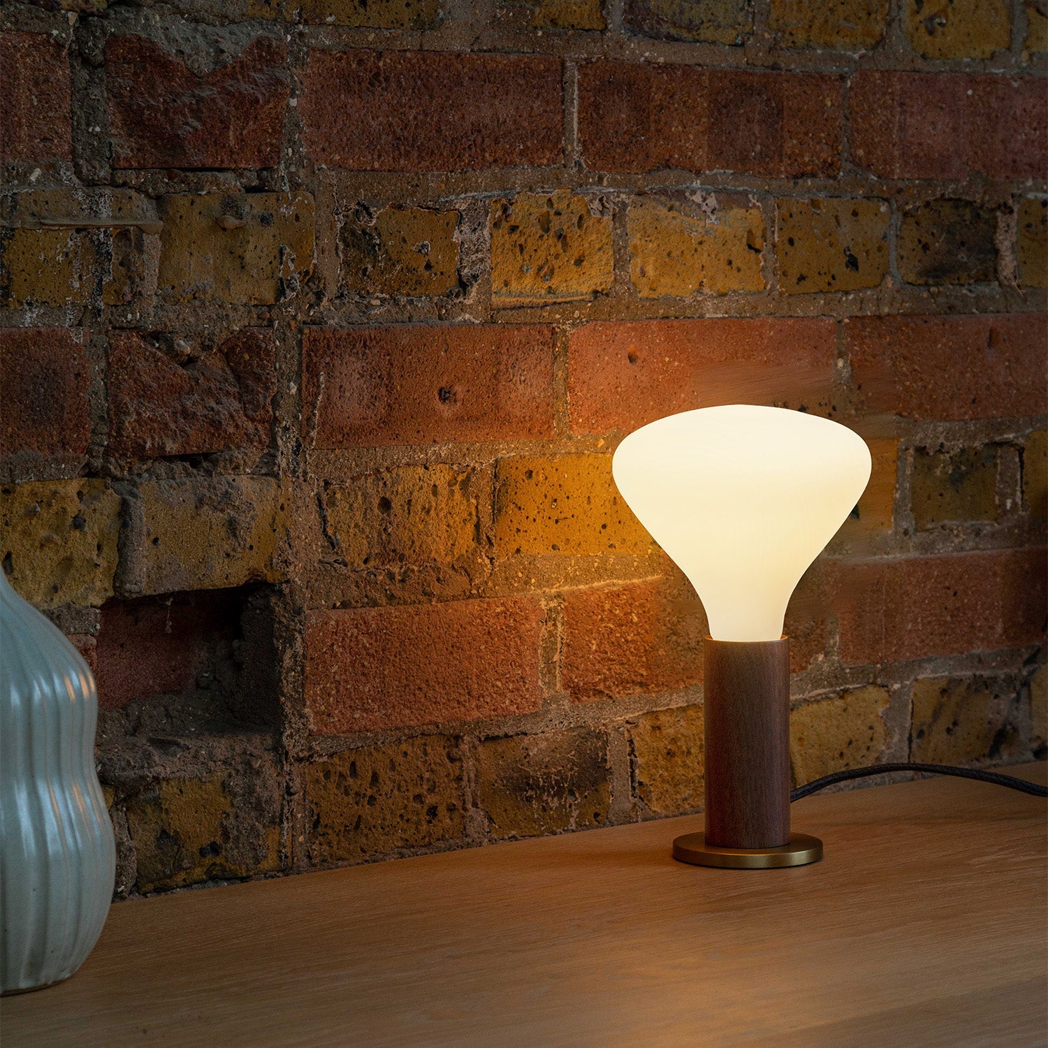 Knuckle Table Lamp in Walnut with Noma bulb, lifestyle setting