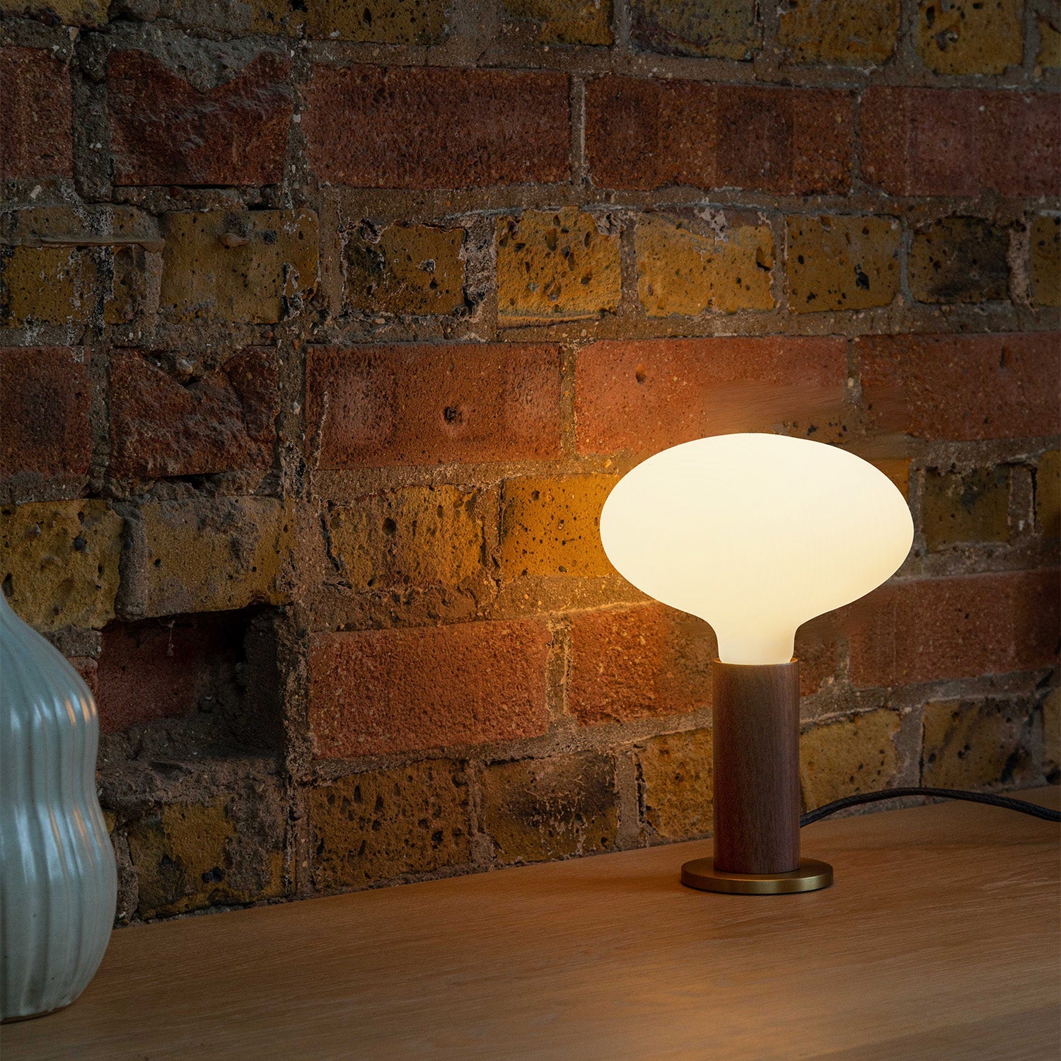 Knuckle Table Lamp in Walnut with Oval bulb, lifestyle setting