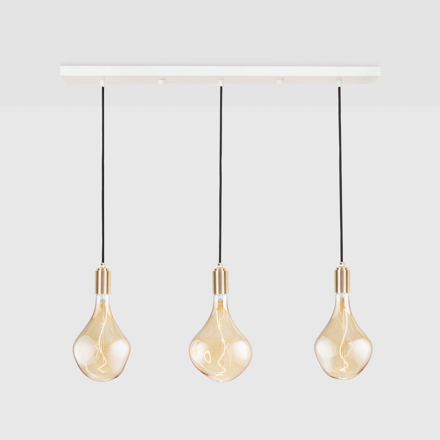 Tala Linear Triple Pendant in Brass, product shot on plain background