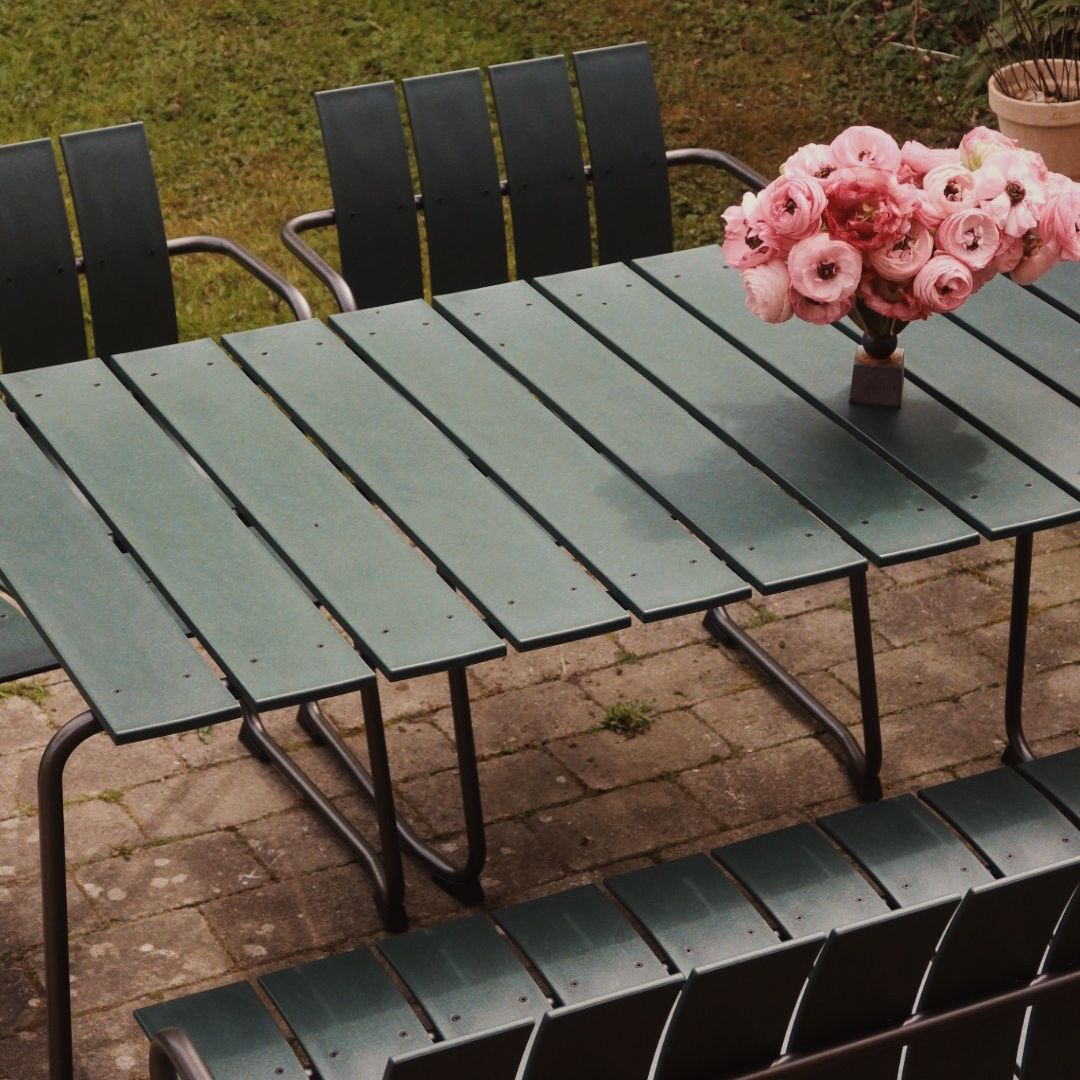 Mater Ocean Bench styled in an outdoor setting, slats of recycled plastic waste