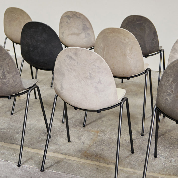 Mater Eternity Side Chair in Coffee Waste Black styled in an interior setting, Matek shell on a recycled steel frame