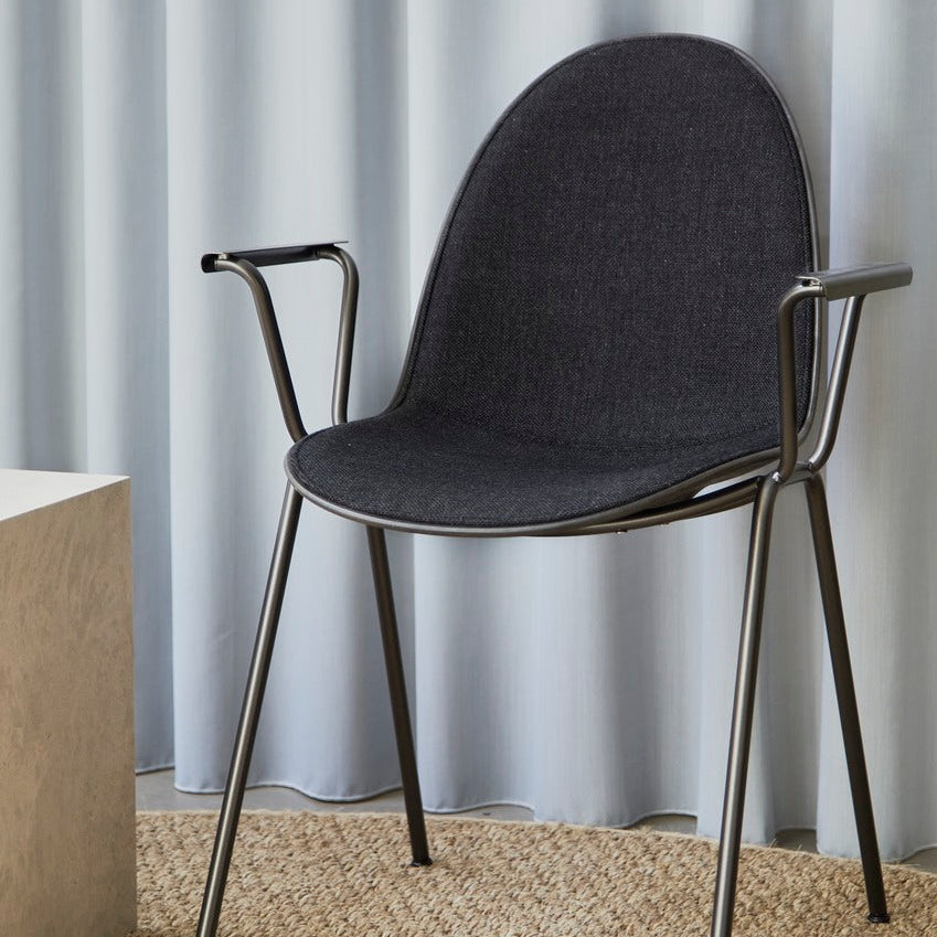 Mater Eternity Arm Chair in upholstered gray Re-wool styled in an interior setting, Matek shell