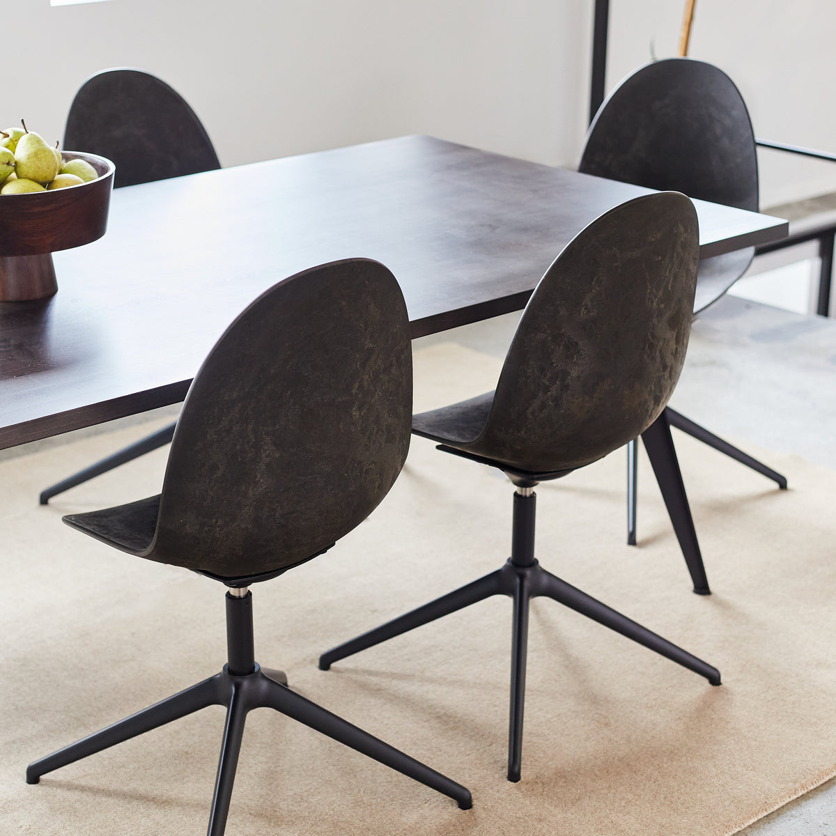 Mater Eternity Swivel Chair in Coffee Waste Black styled in an interior setting, Matek shell on a recycled aluminum base