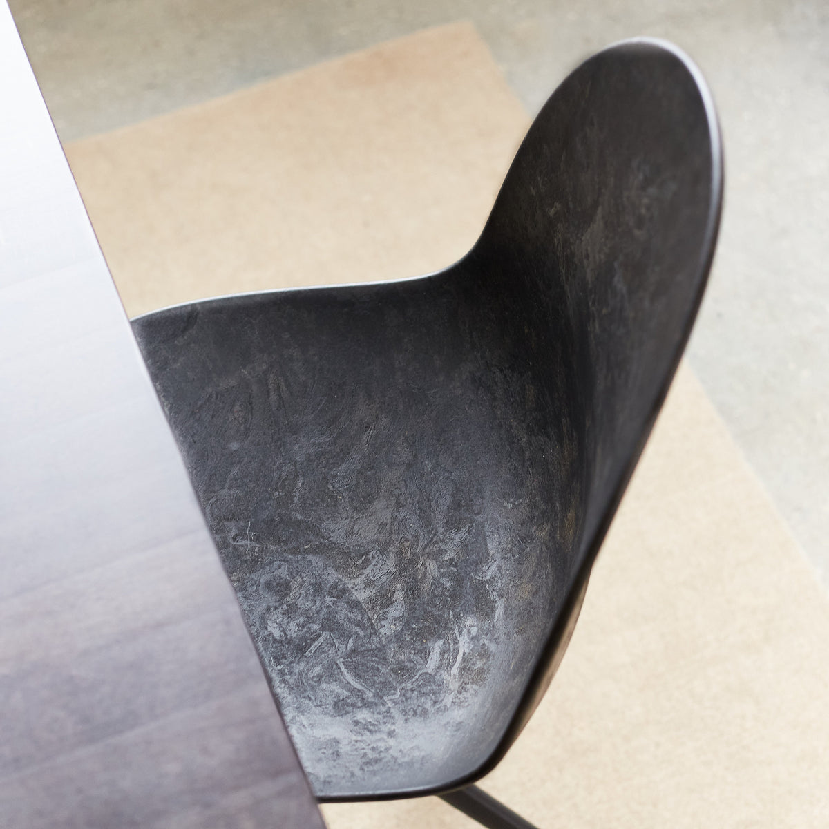Detail of Mater Eternity Swivel Chair in Coffee Waste Black showing the seat from above