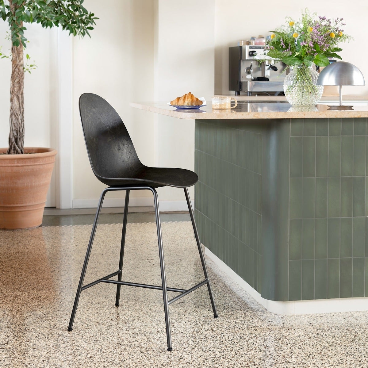Mater Eternity seating in Coffee Waste Black styled in an interior setting, Matek composite
