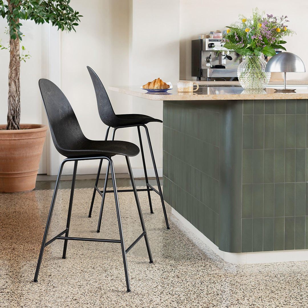 Mater Eternity seating in Coffee Waste Black styled in an interior setting, Matek composite