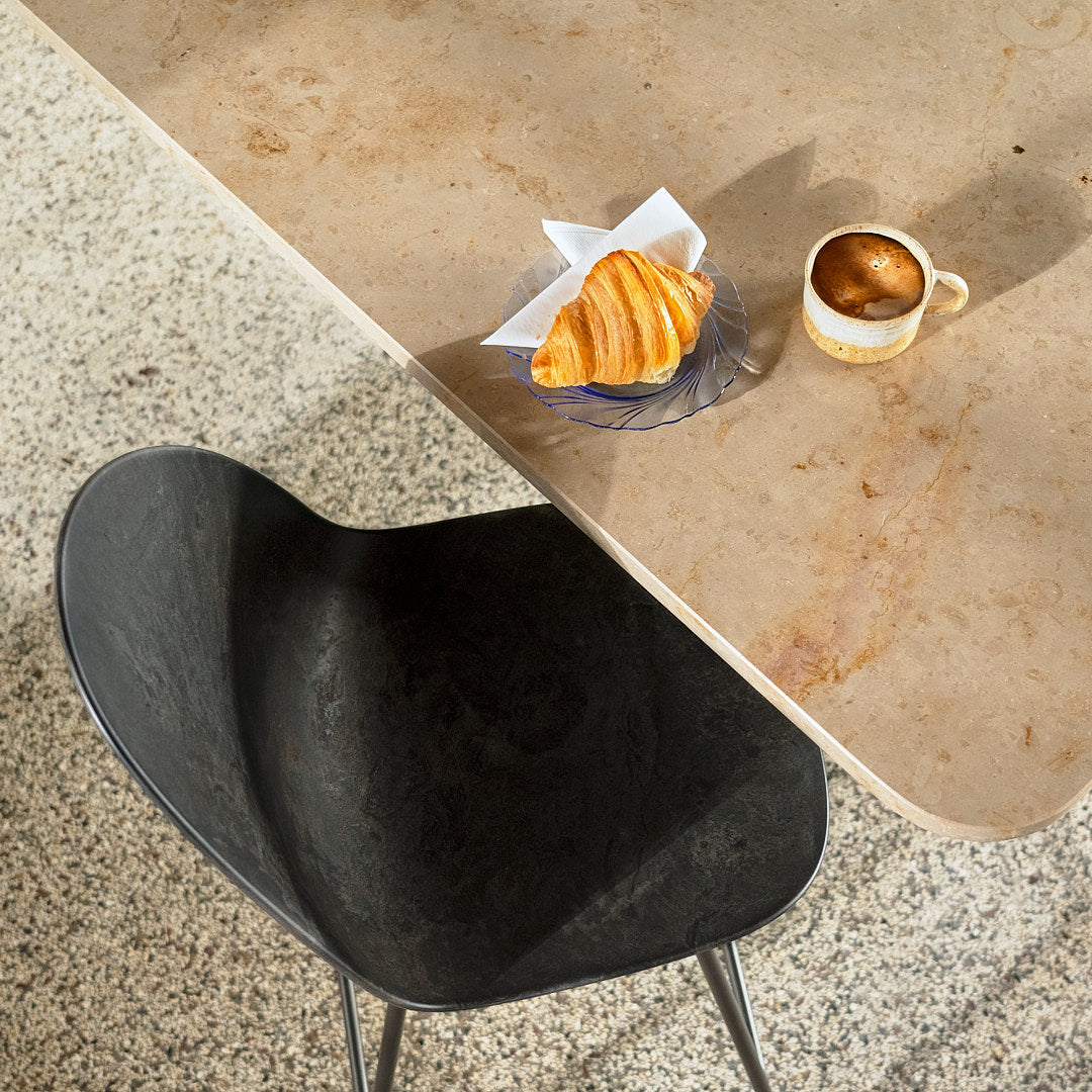 Mater Eternity seating in Coffee Waste Black styled in an interior setting, Matek composite