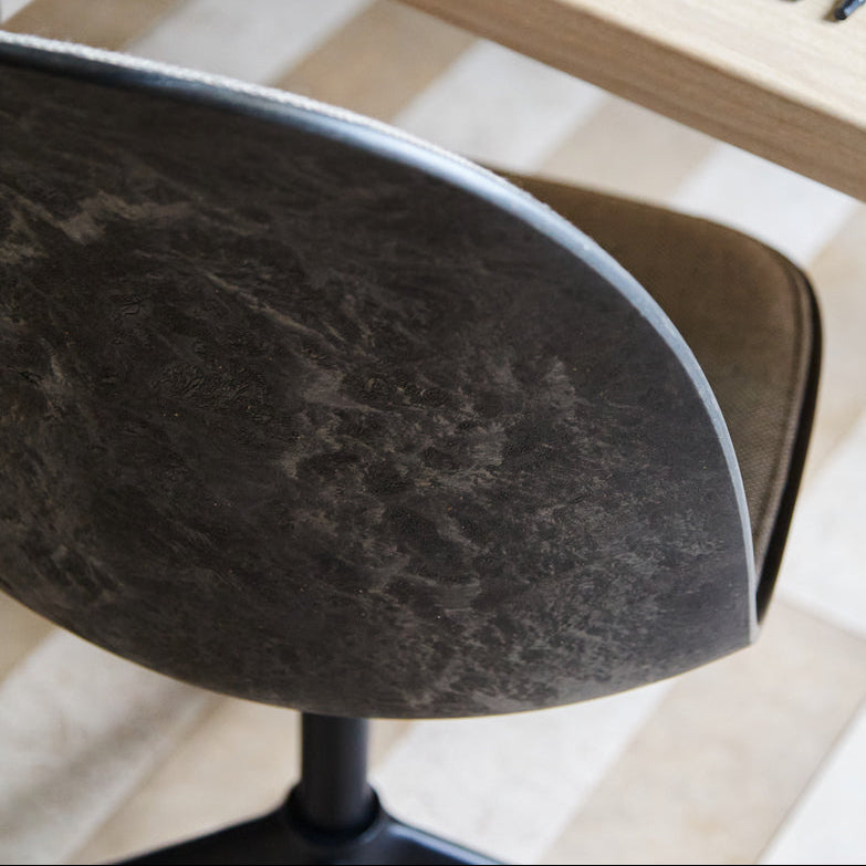 Mater Eternity Swivel Chair in upholstered beige Re-wool, styled in an interior setting