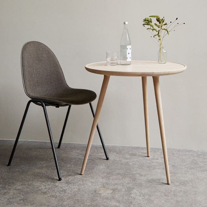 Mater Eternity Side Chair in Coffee Waste Dark styled in an interior setting, Matek shell on a recycled steel frame