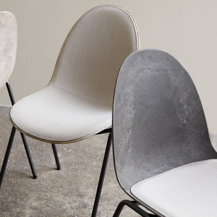 Detail of Mater Eternity Side Chair in Coffee Waste Dark showing the upholstered seat option