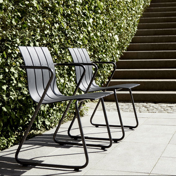 Mater Ocean Chair styled in an outdoor setting, slats of recycled plastic waste