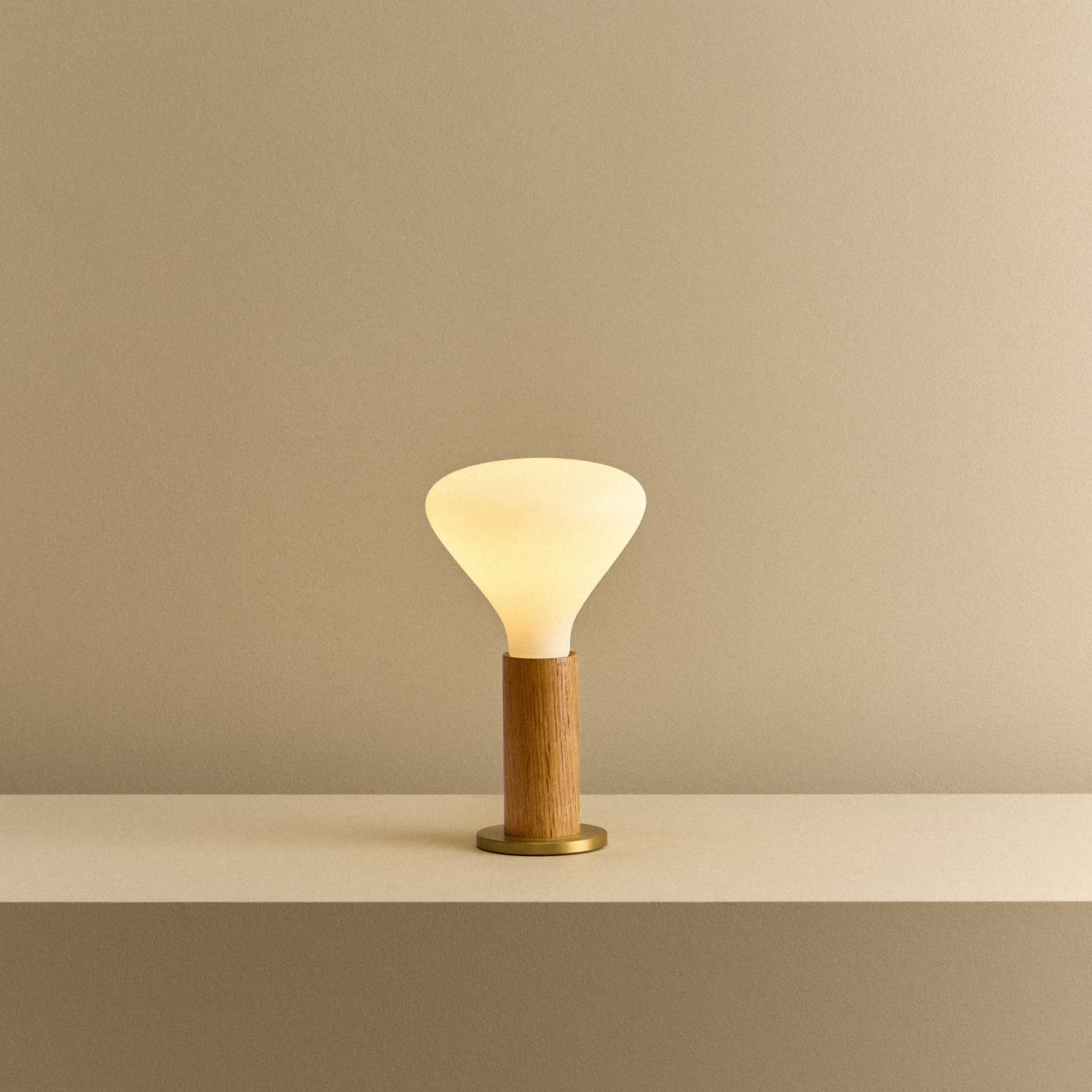 Knuckle Table Lamp in Oak with Noma bulb, illuminated