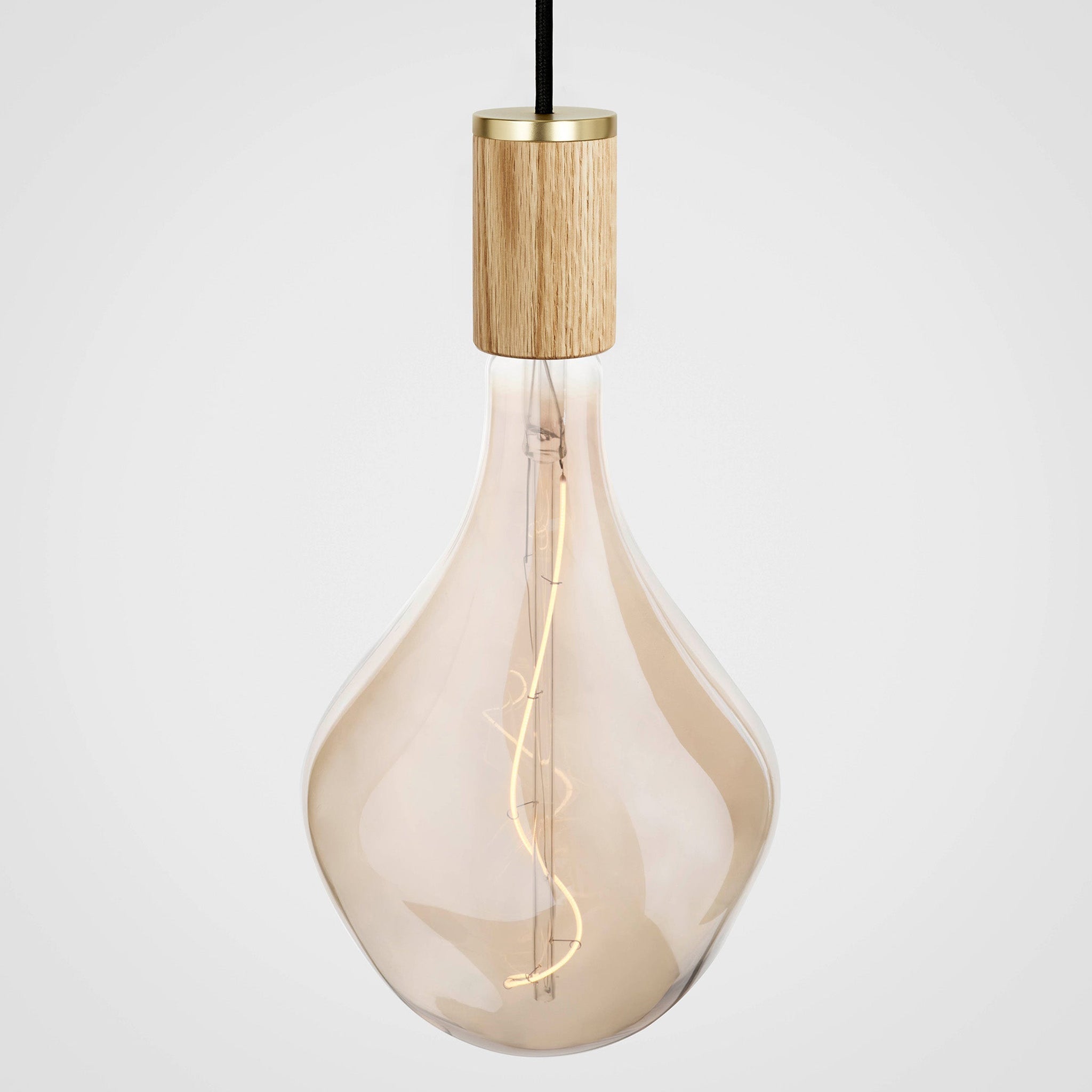 Voronoi II bulb in Oak pendant, lit, grey background
