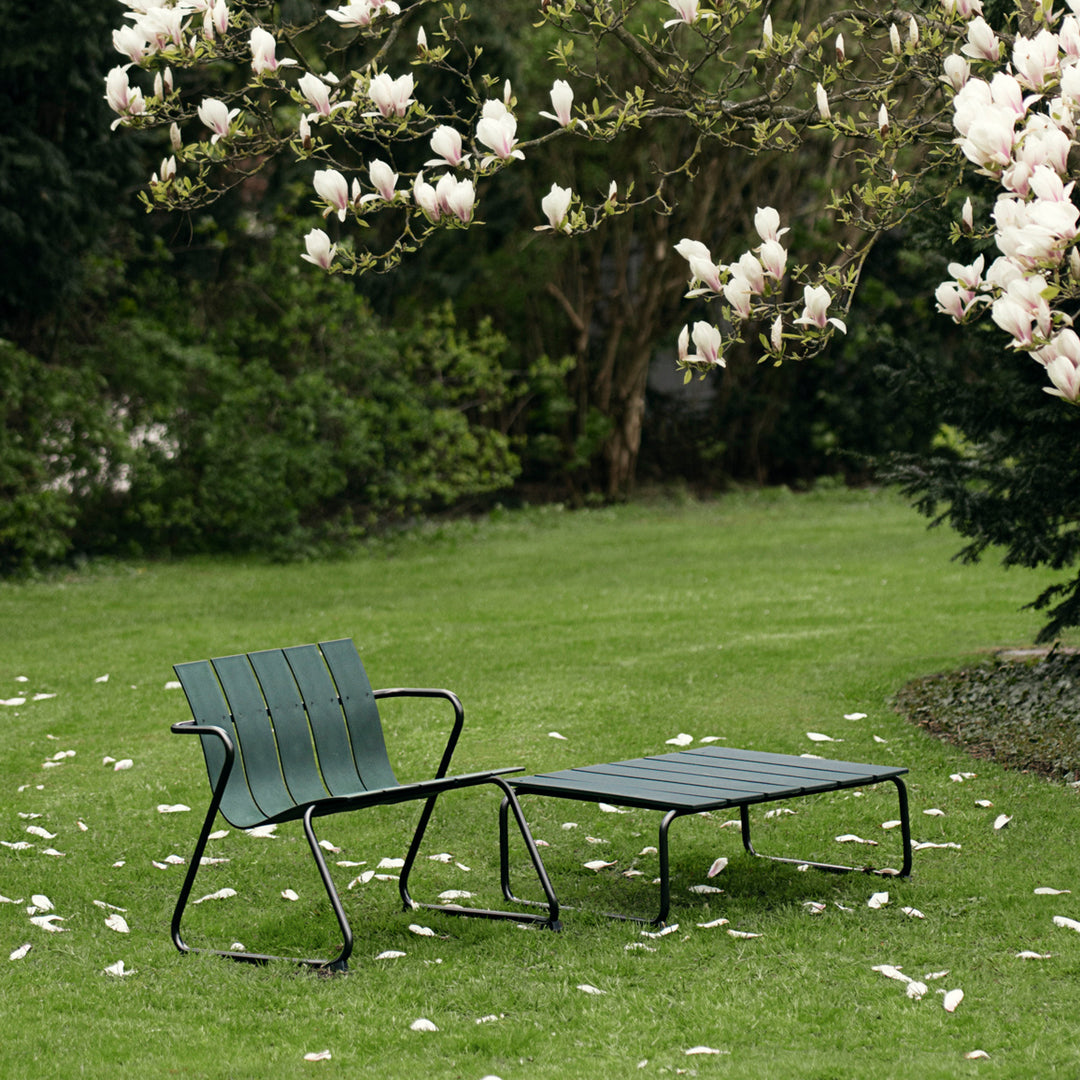 Mater Ocean Lounge Chair styled in an outdoor setting, slats of recycled plastic waste