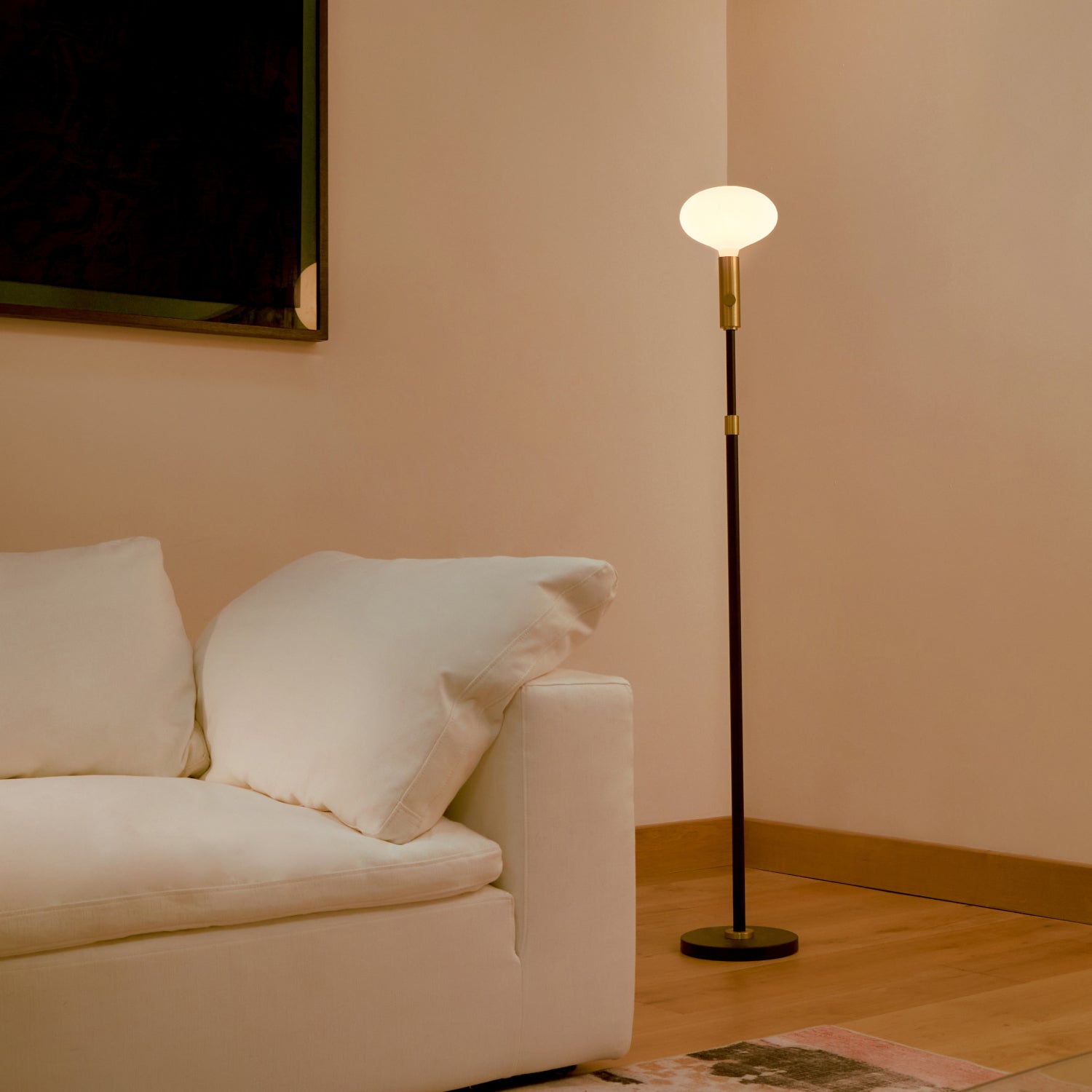 Tala Poise Adjustable Floor Lamp in Brass with Oval II bulb, lifestyle setting