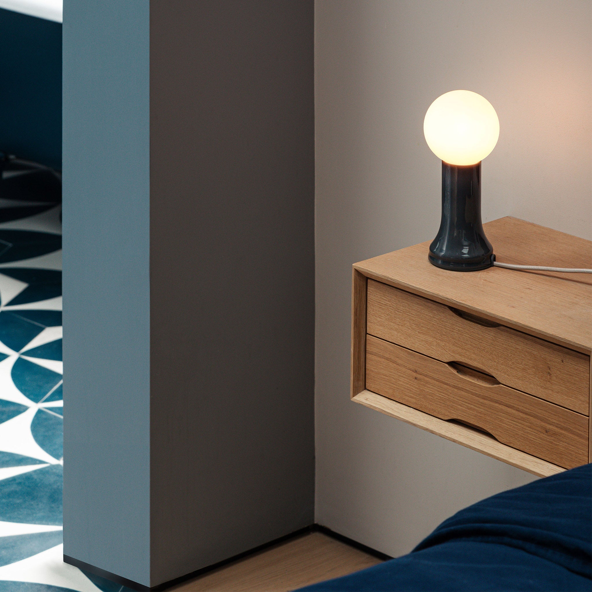 Tala Shore Table Lamp in Bottle Brown — mouth-blown glass table lamp (base detail)