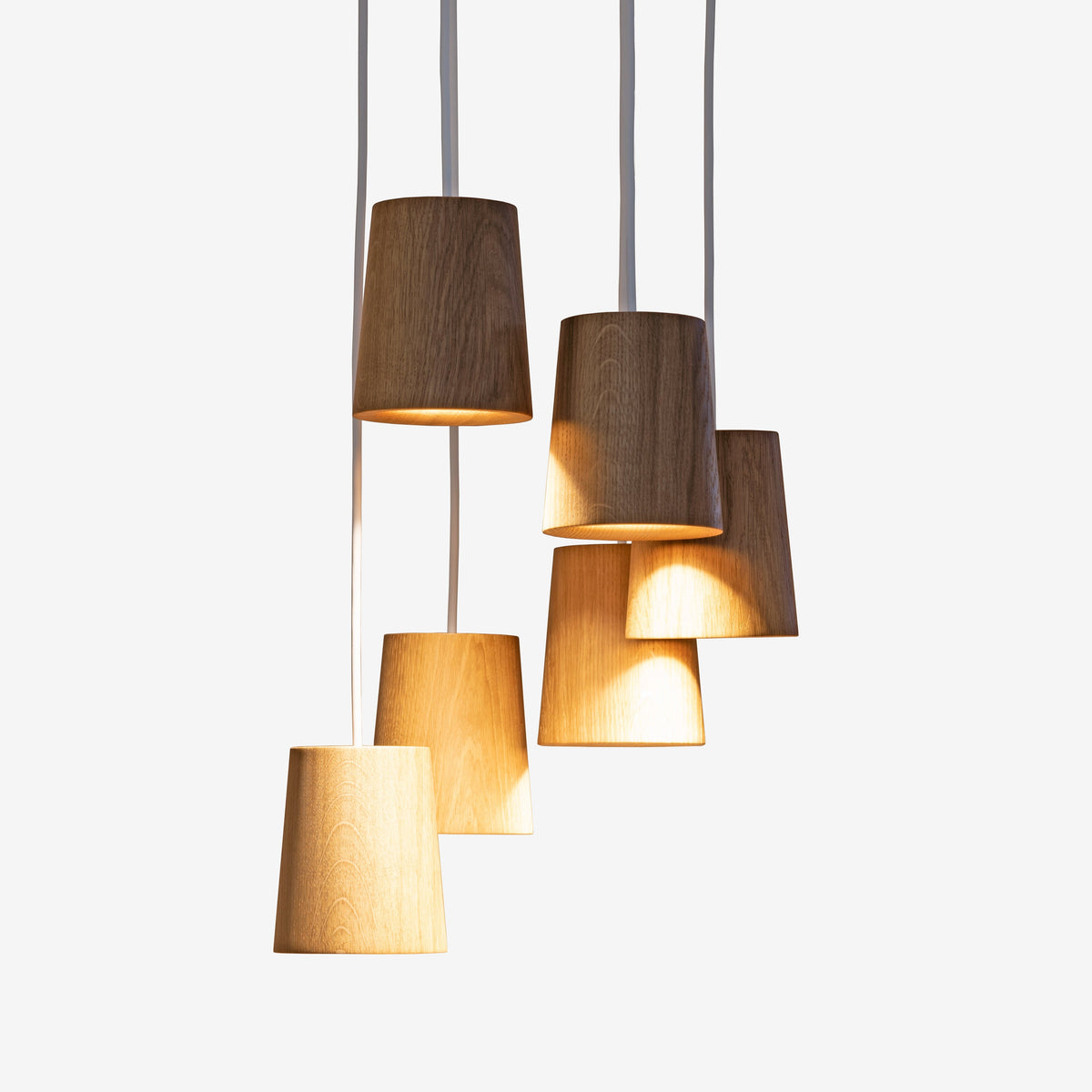 Case Solid Six Pendant Cluster in Oak, staggered cones, solid oak