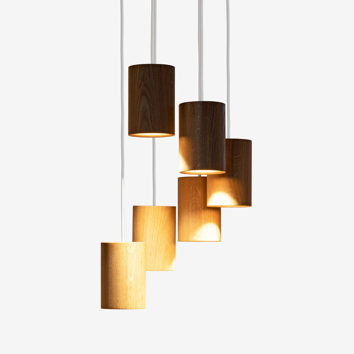 Case Solid Six Pendant Cluster in Oak, staggered cylinders, solid oak