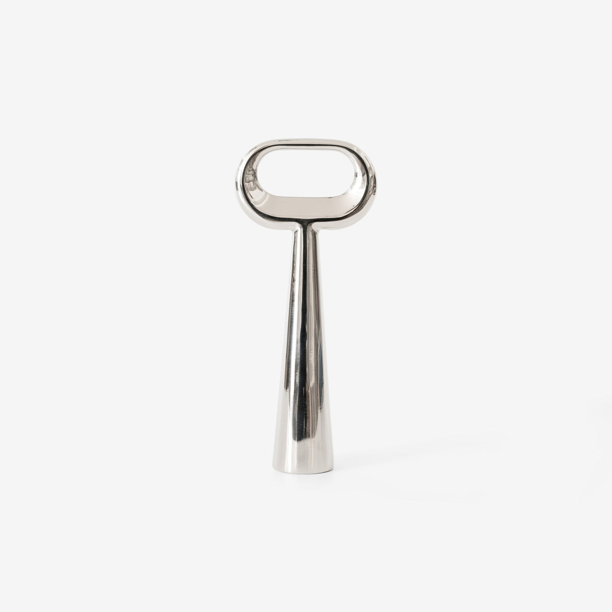 Case Stand Bottle Opener standing upright, cast polished stainless steel
