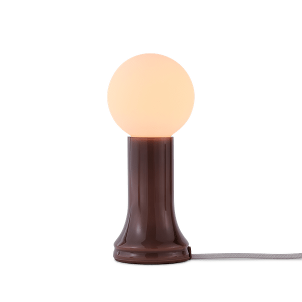 Tala Shore table lamp in Bottle Brown glass lit, showing warm LED glow