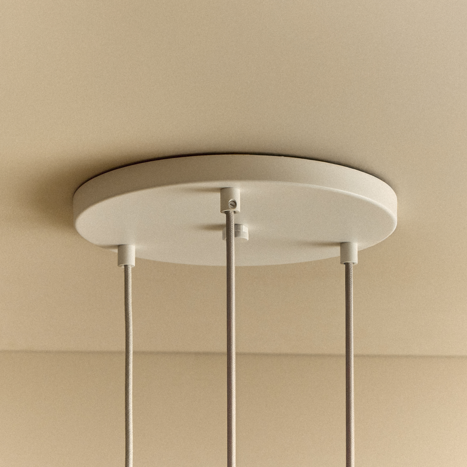 Alumina Triple Pendant with Sphere V bulbs by Tala, underside view of the Sphere V bulbs