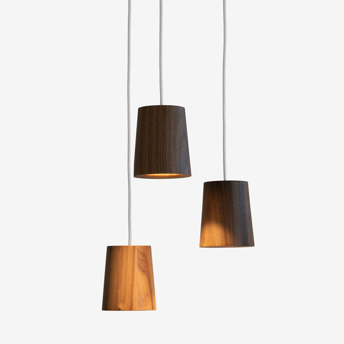 Case Solid Three Pendant Cluster in Walnut, staggered cones, solid walnut