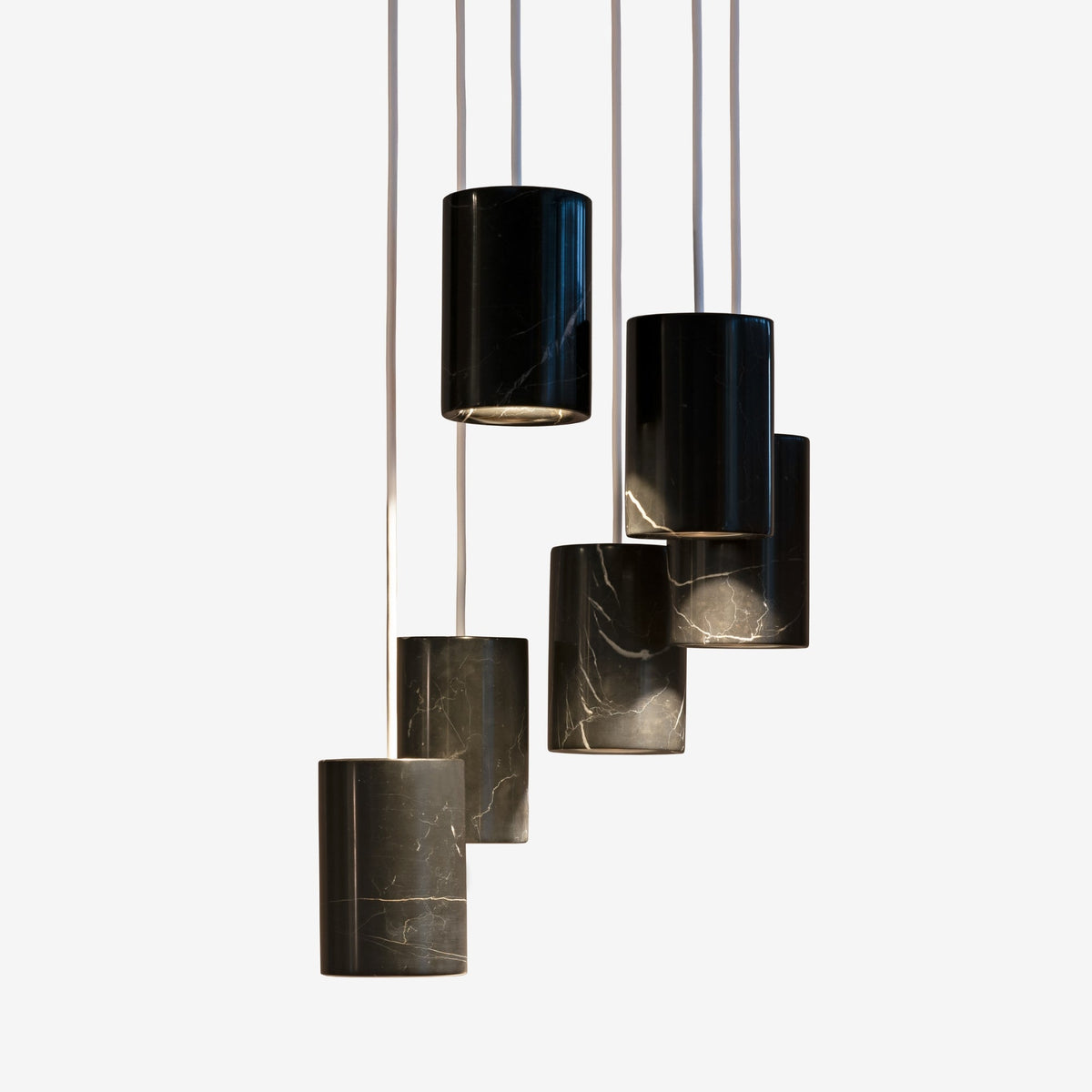 Case Solid Six Pendant Cluster in Nero Marquina, staggered cylinders, Nero Marquina marble