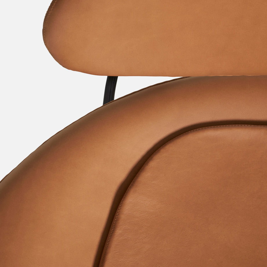 WOUD Meadow Leather Lounge Chair in black leather upholstery on a solid oak frame designed by Foersom & Hiort-Lorenzen