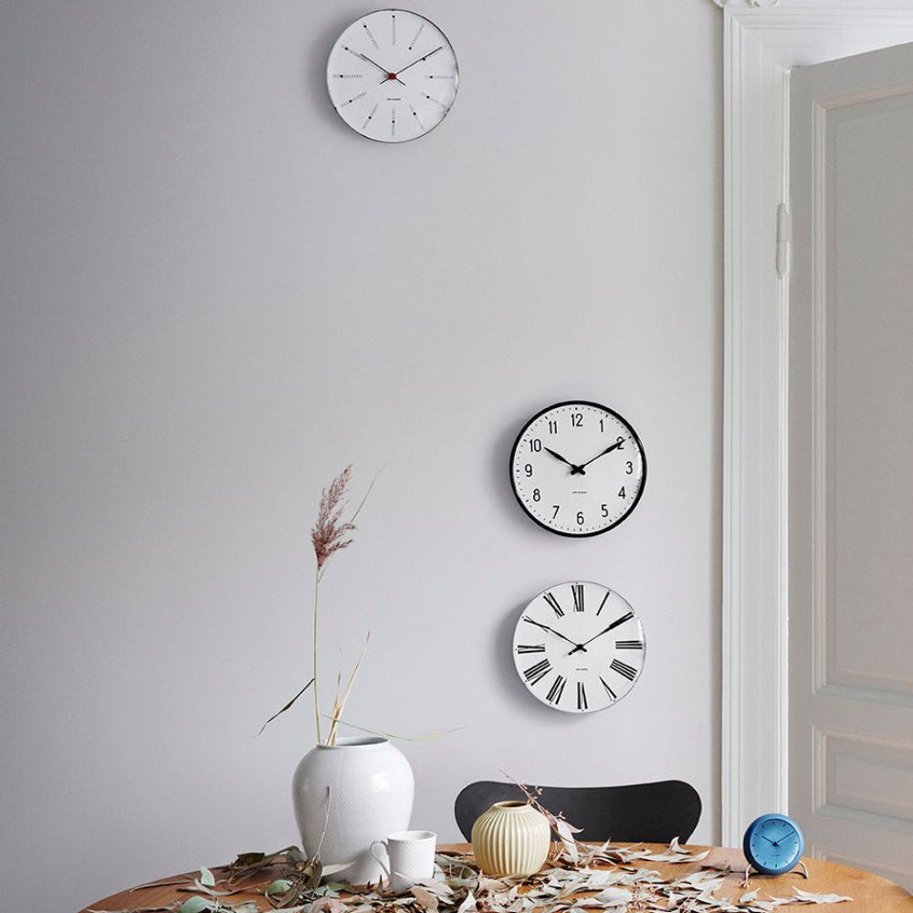 Arne Jacobsen Roman Wall Clock White/Black shown with other pieces
