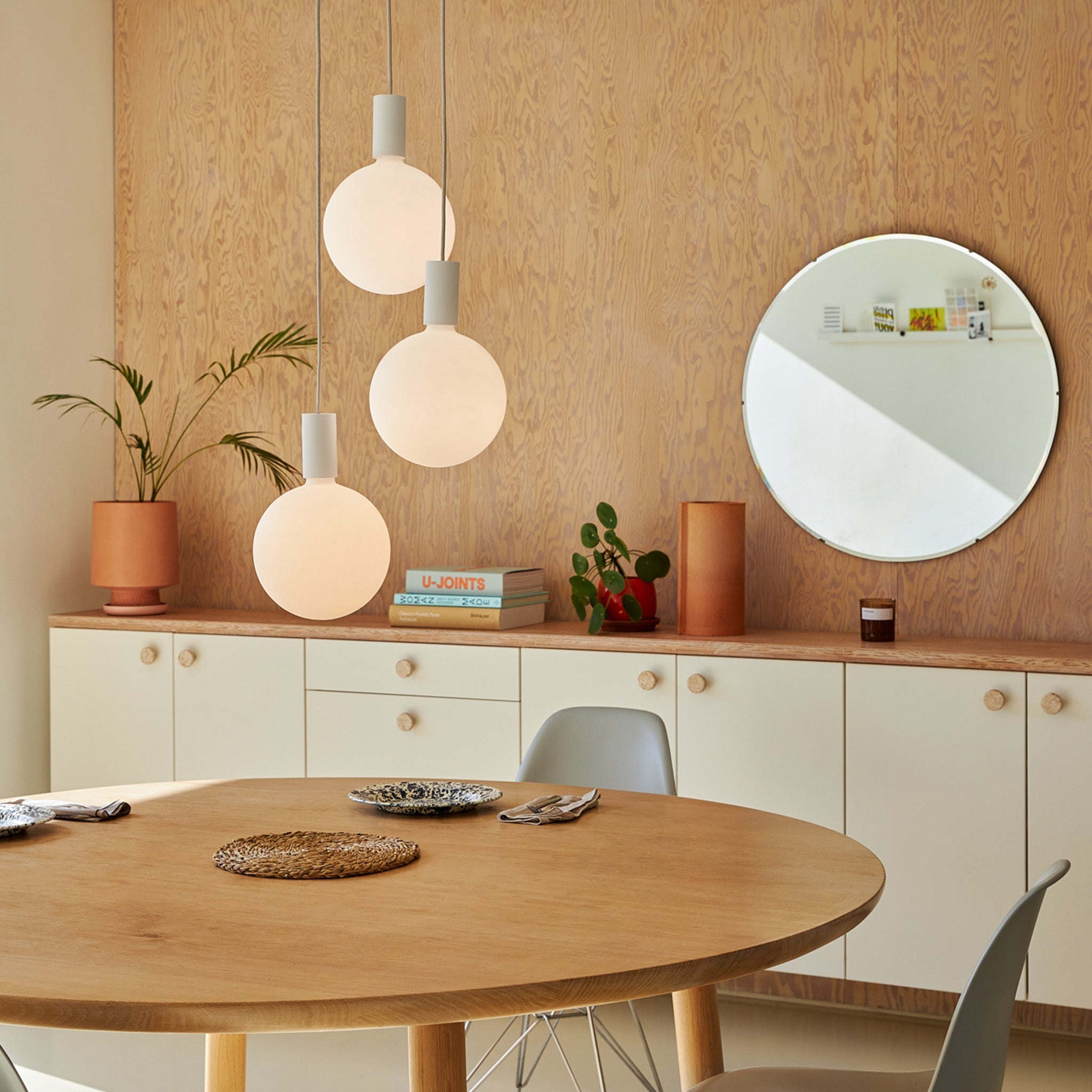 Alumina Triple Pendant with Sphere V bulbs by Tala, full fixture on a white background