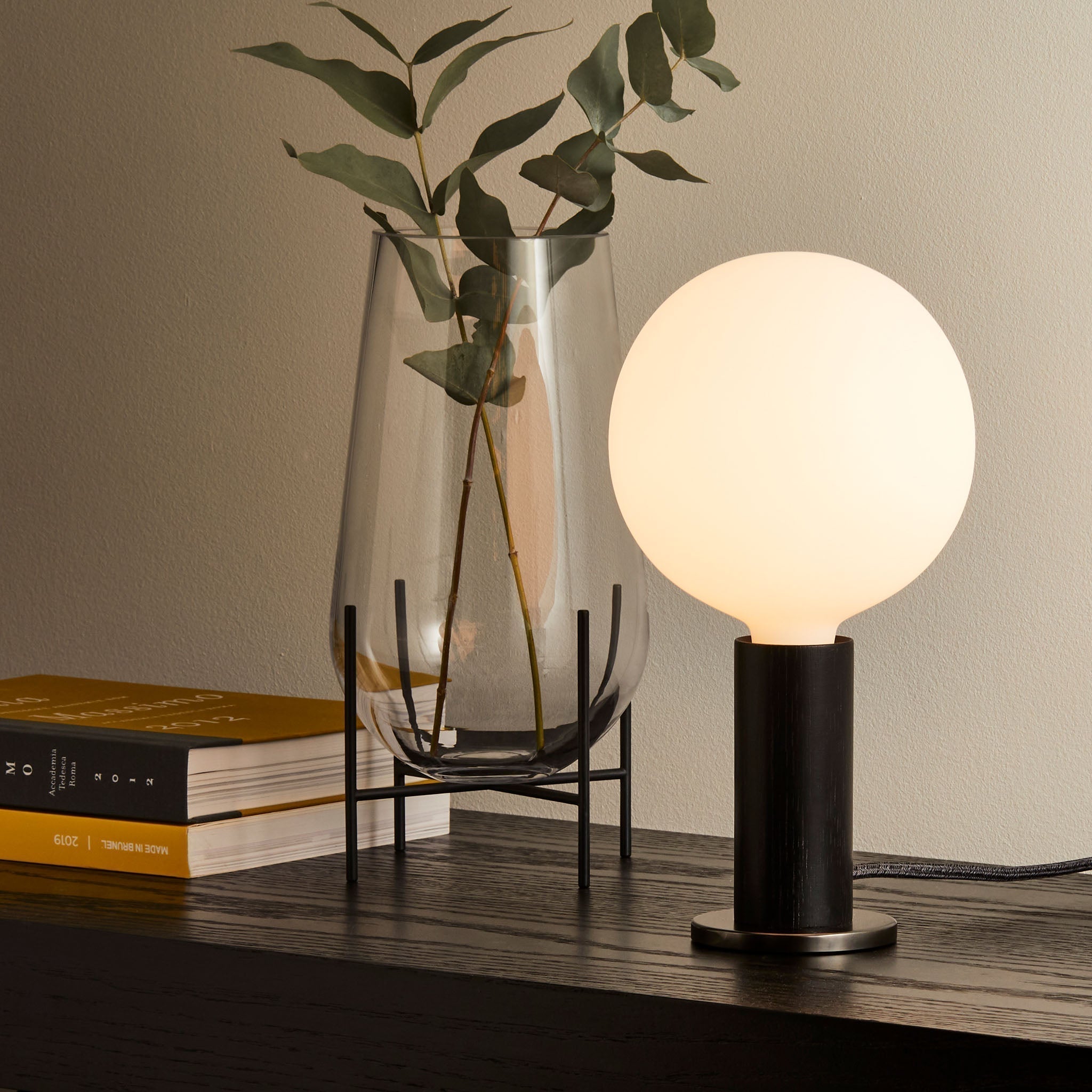 Knuckle Table Lamp in Blackened Oak with Sphere IV bulb, hallway setting