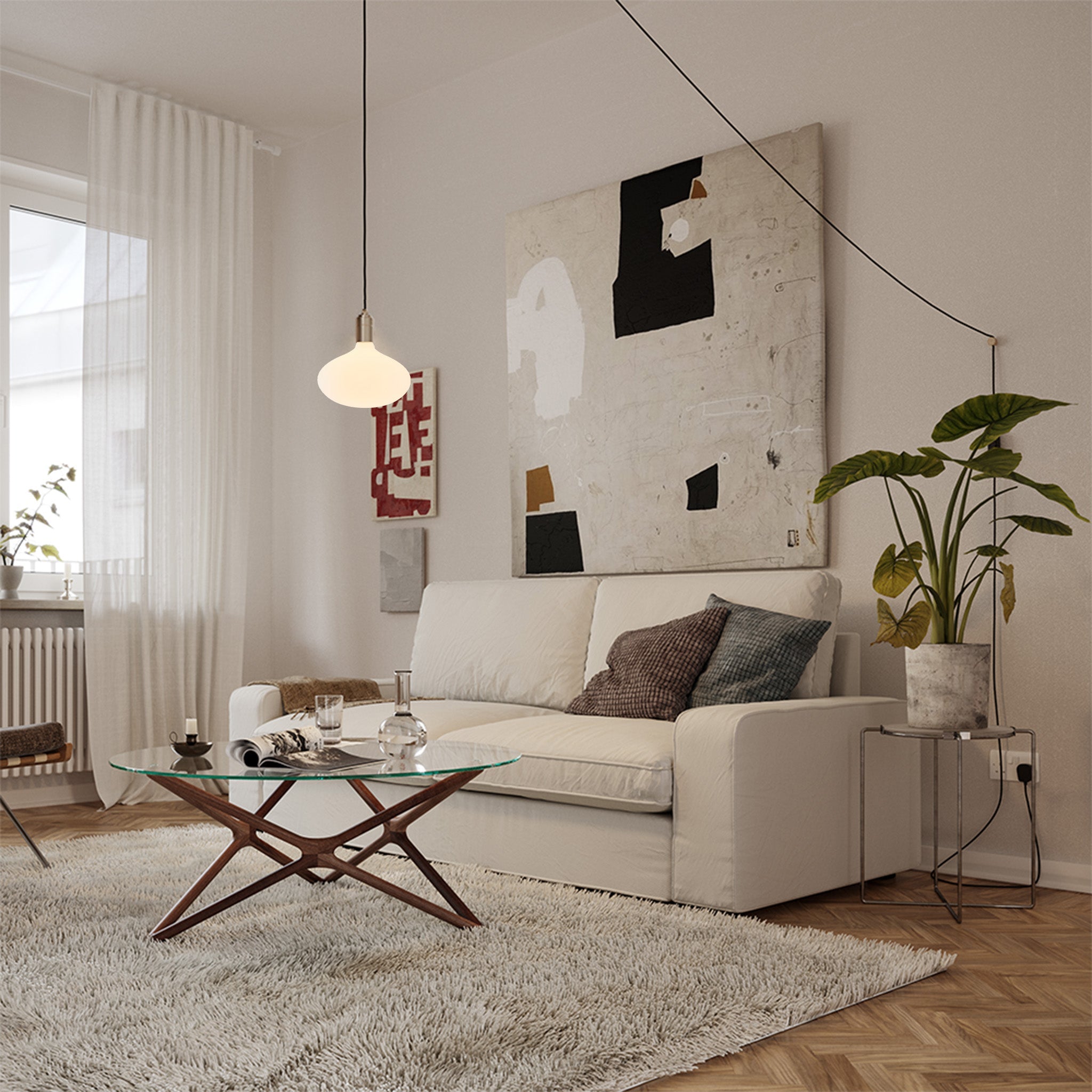Oval II Plug-In Pendant by Tala — lifestyle, living room setting, graphite