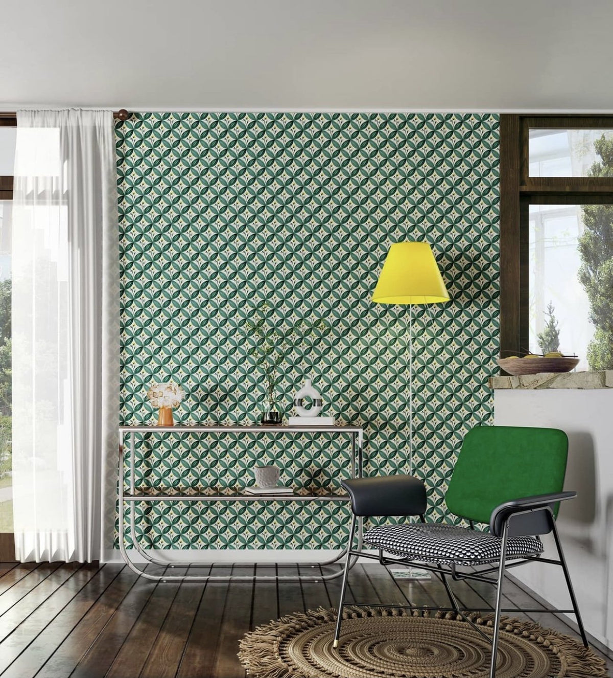 Luceplan Costanza Floor Lamp with a yellow shade beside a green armchair, styled in an interior setting